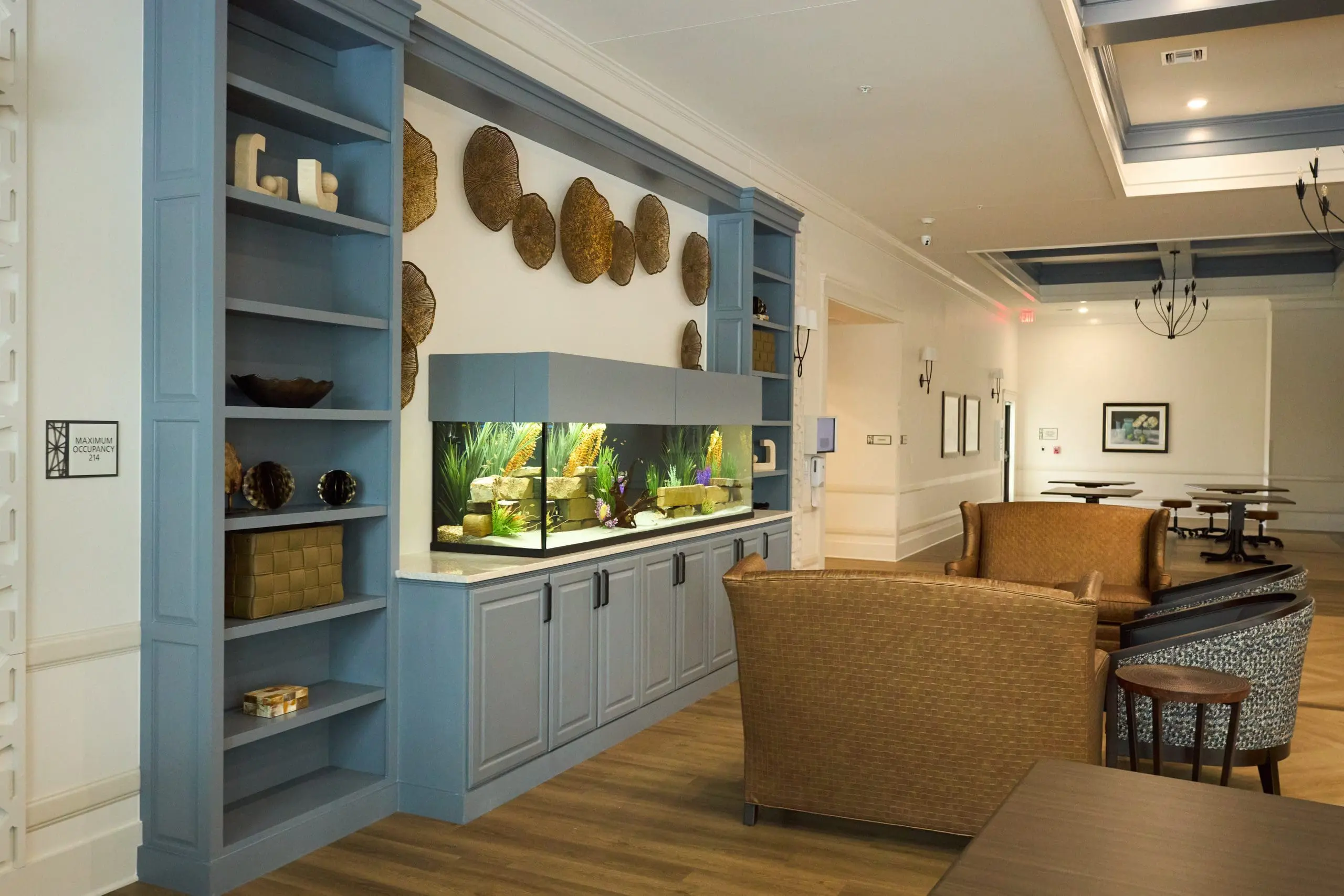 Lounge area with chairs and a fish tank